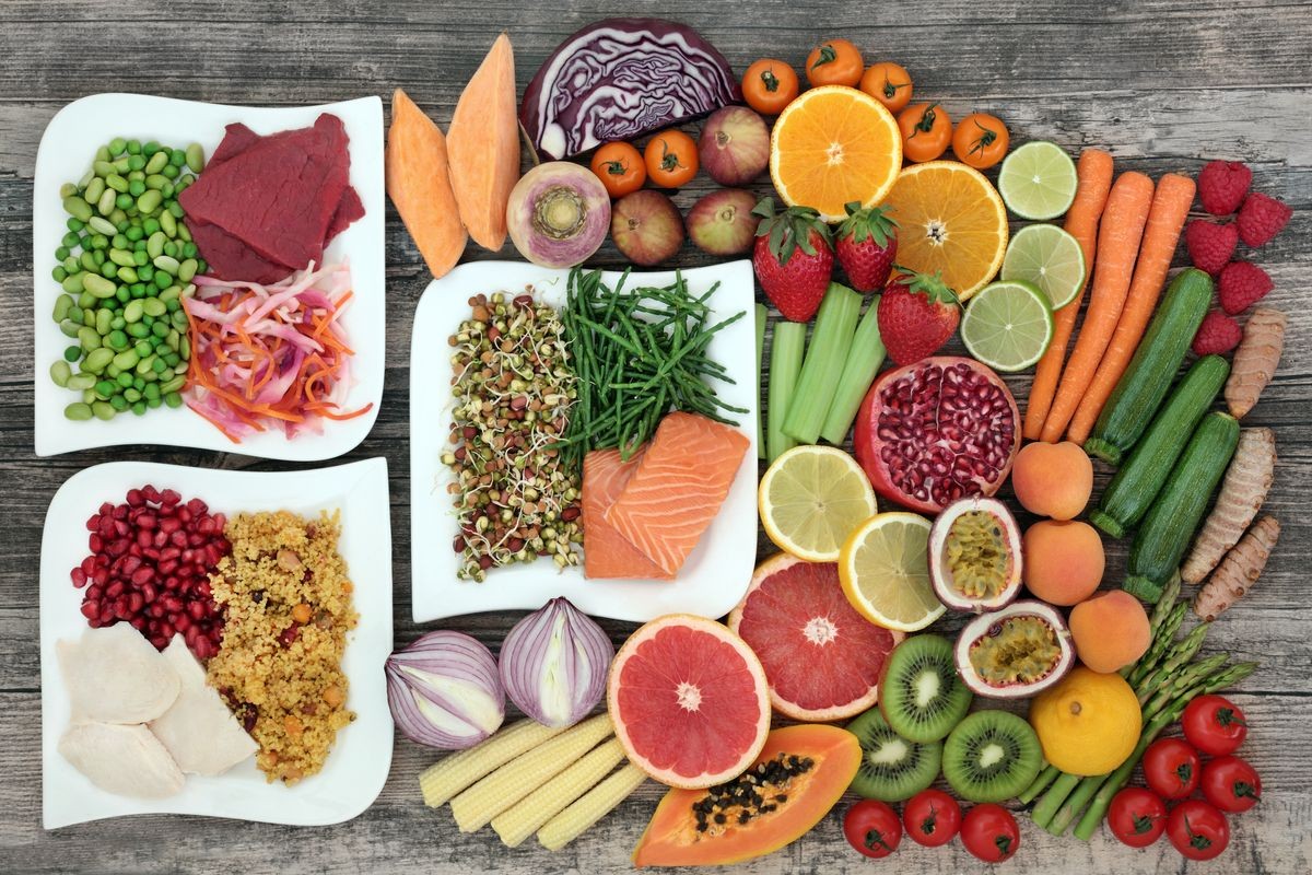 Diet health food concept with a large variety of vegetables, fruit, meat, fish, grain salad and spice with foods high in  protein, antioxidants, dietary fibre, anthocaynins and vitamins. Top view.